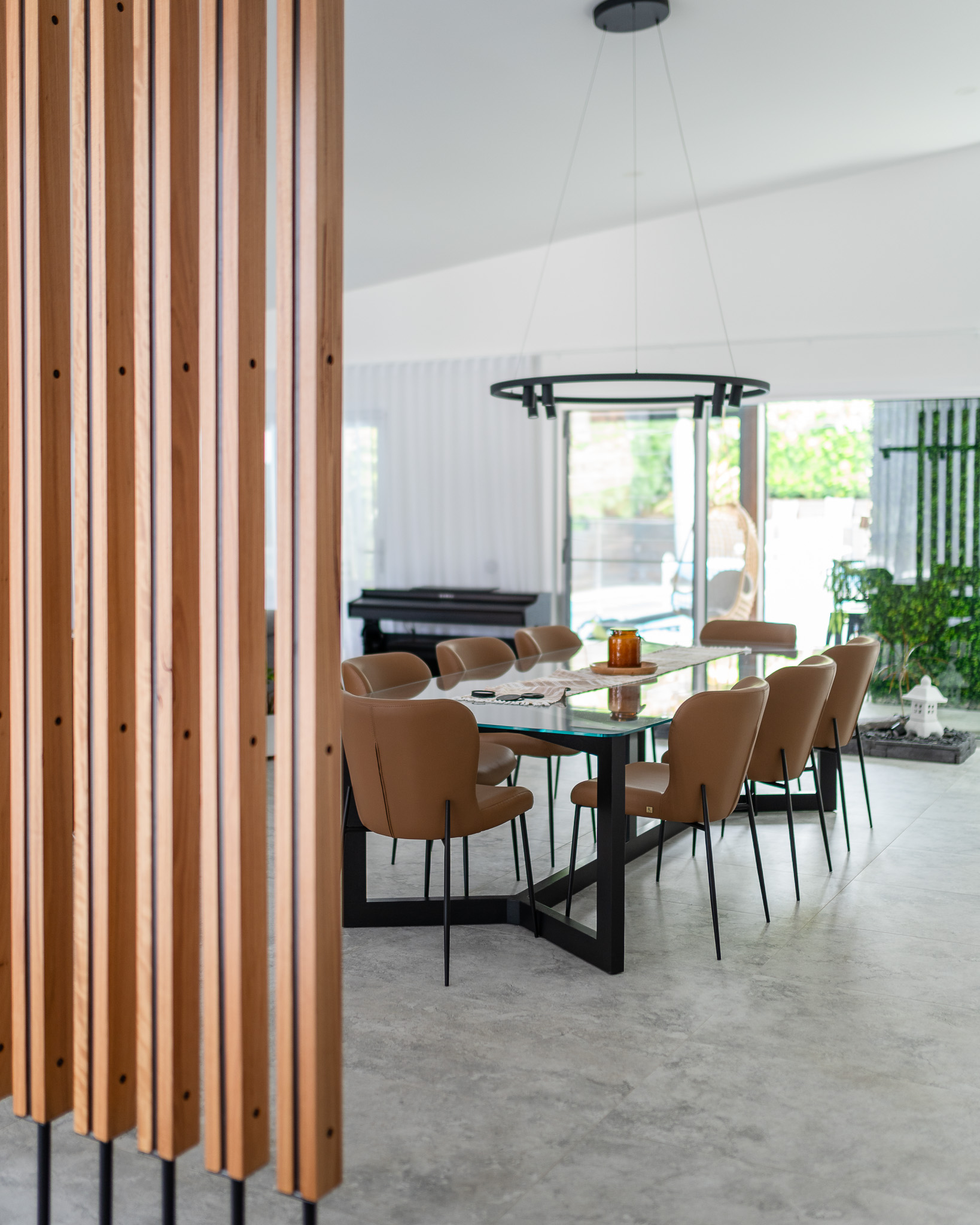 dining area with timber vertical room divider