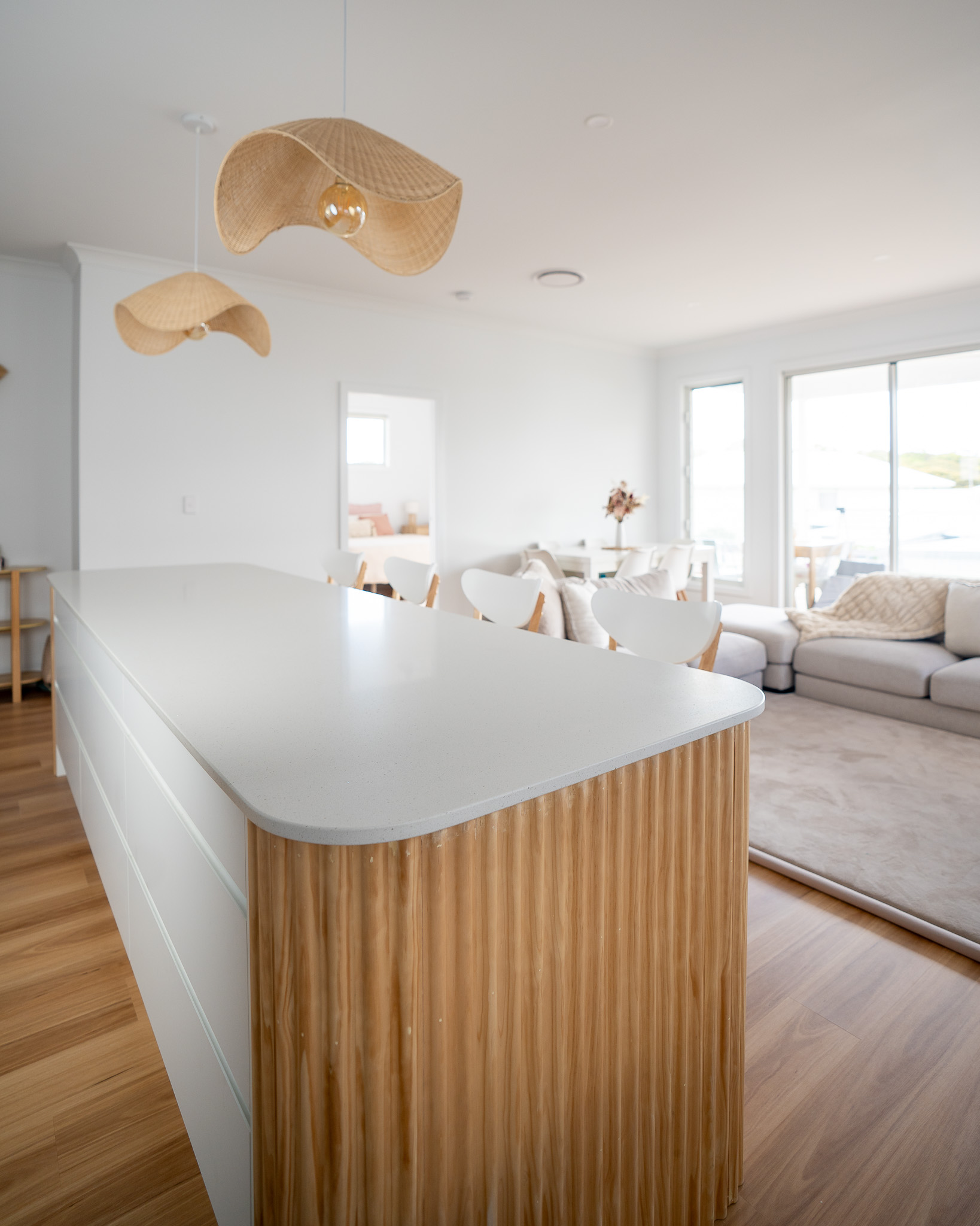 kitchen bench with timber details and hanging pendant lights